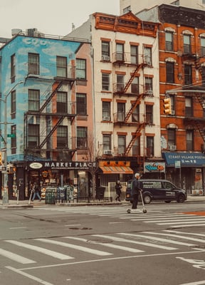 Colorful brick street corner with murals in the East Village