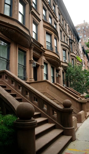 Classic brownstone row houses with ornate stairs on the Upper East Side