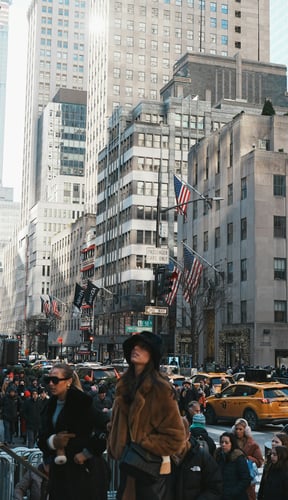 Busy 5th Avenue with skyscrapers and yellow taxis in Midtown Manhattan