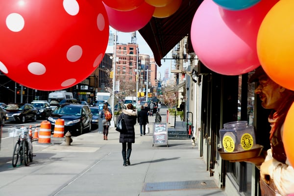 Colorful balloons outside a shop on a Lower Manhattan street